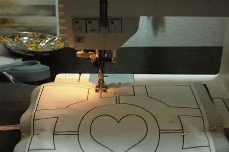 Image titled Sew along the lines with a short machine stitch. Remember, the pink lines are ALREADY sewn, and you can ignore those lines during this step.