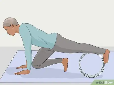 Image titled Use a Yoga Wheel Step 9
