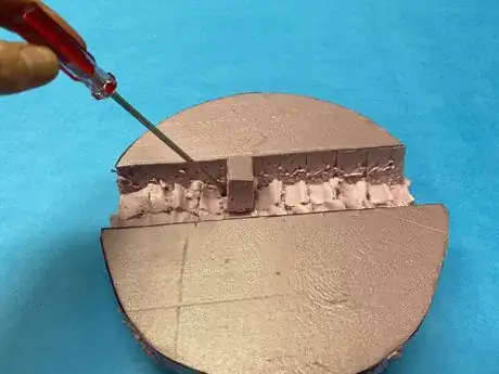 Image titled Remove_foam_chunks_with_screwdriver