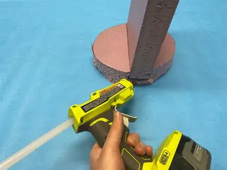 Image titled Slide_foam_together_add_hot_glue