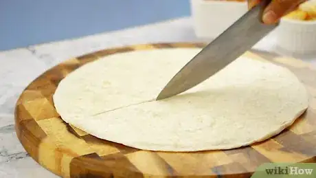 Image titled Make a Wrap Without Breaking the Tortilla Step 1