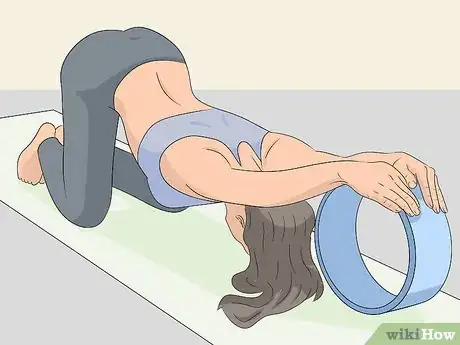 Image titled Use a Yoga Wheel Step 5