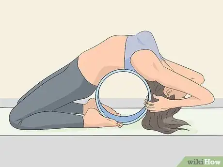 Image titled Use a Yoga Wheel Step 2