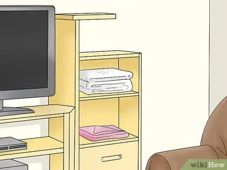 Image titled Decorate Entertainment Center Shelves Step 8