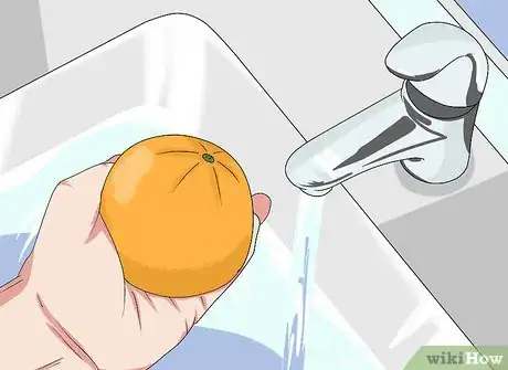 Image titled Bake a Cake Inside a Hollowed Orange over a Campfire Step 1