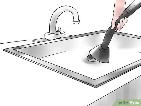 Image titled Remove a Glass from a Garbage Disposal Step 4
