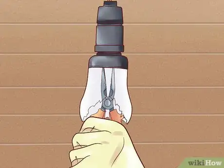 Image titled Remove a Broken Lightbulb from the Socket Step 8