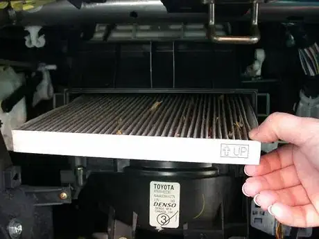 Image titled Slide the old filter out like a drawer.