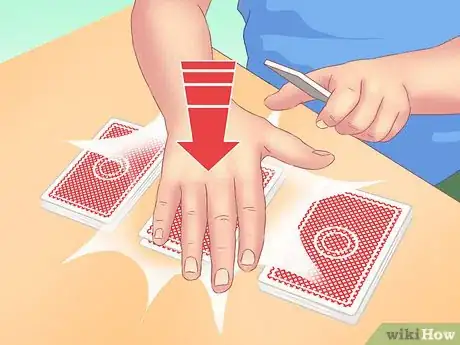 Image titled Make a Card Fall Through a Table Step 6