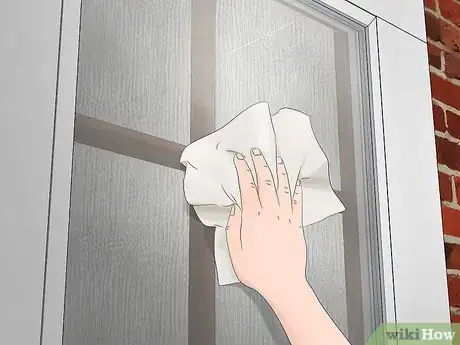 Image titled Hang a Wreath on a Storm Door Step 3