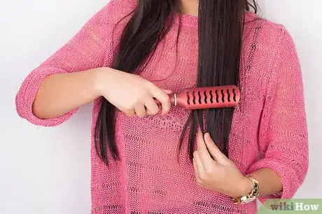 Image titled Put Frizzy Hair Into a Bun Step 1