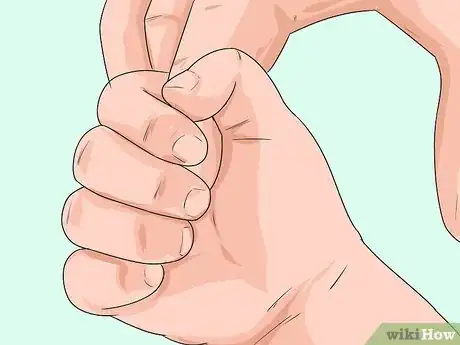 Image titled Encourage Your Baby to Build Finger Muscles Step 1