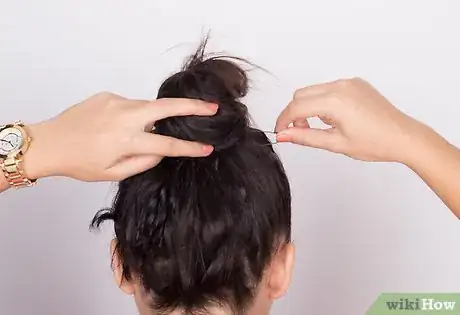 Image titled Put Frizzy Hair Into a Bun Step 6