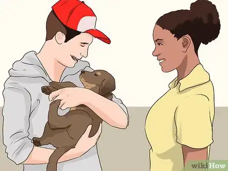 Image titled Socialize a Puppy from a One Pup Litter Step 9