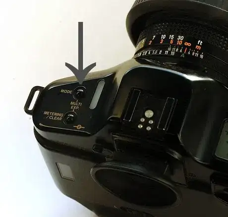 Image titled Canon_T90_mode_button_965.JPG