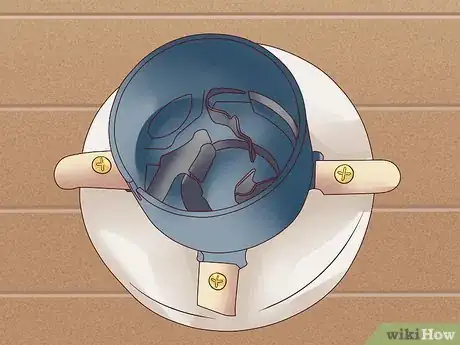 Image titled Remove a Broken Lightbulb from the Socket Step 12