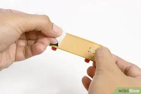 Image titled Take Griptape Off of a Tech Deck Step 4