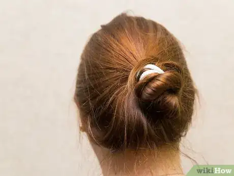 Image titled Put on a Swim Cap Step 1