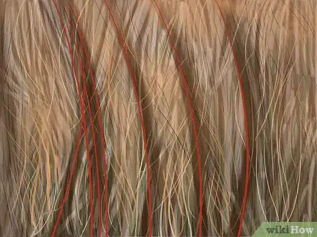 Image titled Cut and Gather String or Net Wrap Off of Round Bales Step 5