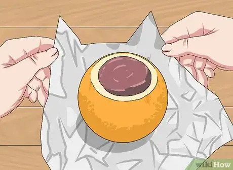 Image titled Bake a Cake Inside a Hollowed Orange over a Campfire Step 9