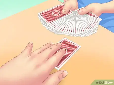 Image titled Make a Card Fall Through a Table Step 2