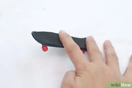 Image titled Do a Truckstand on a Tech Deck Step 3